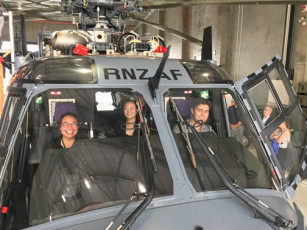 Interns sitting in a helicopter