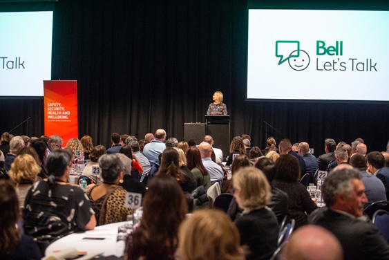 Mary Deacon, Chair Bell Canada Let's Talk, speaking at the Mental Health and Wellbeing Conference.